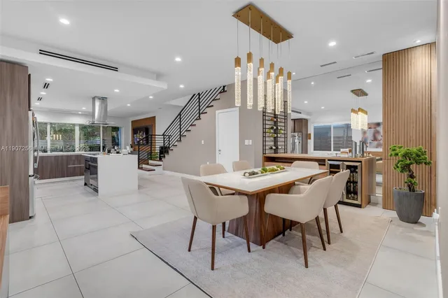 a dining room with furniture and entryway