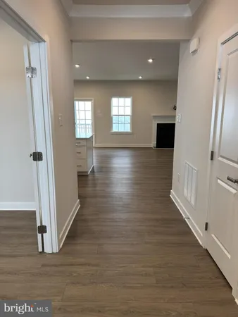 a view of gallery with wooden floor