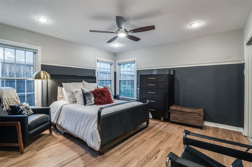 3714 Valley Ridge Road Dallas, TX 75220 - Photo 13 of 26 a bedroom with a bed and wooden floor