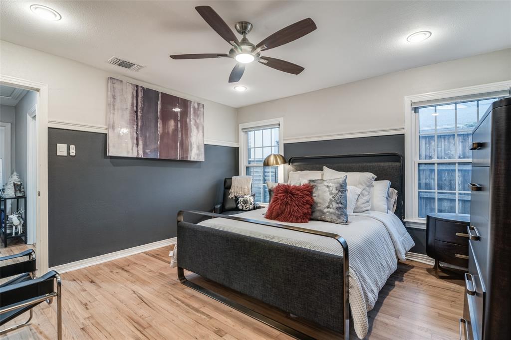 3714 Valley Ridge Road Dallas, TX 75220 - Photo 14 of 26 a bedroom with bed and wooden floor