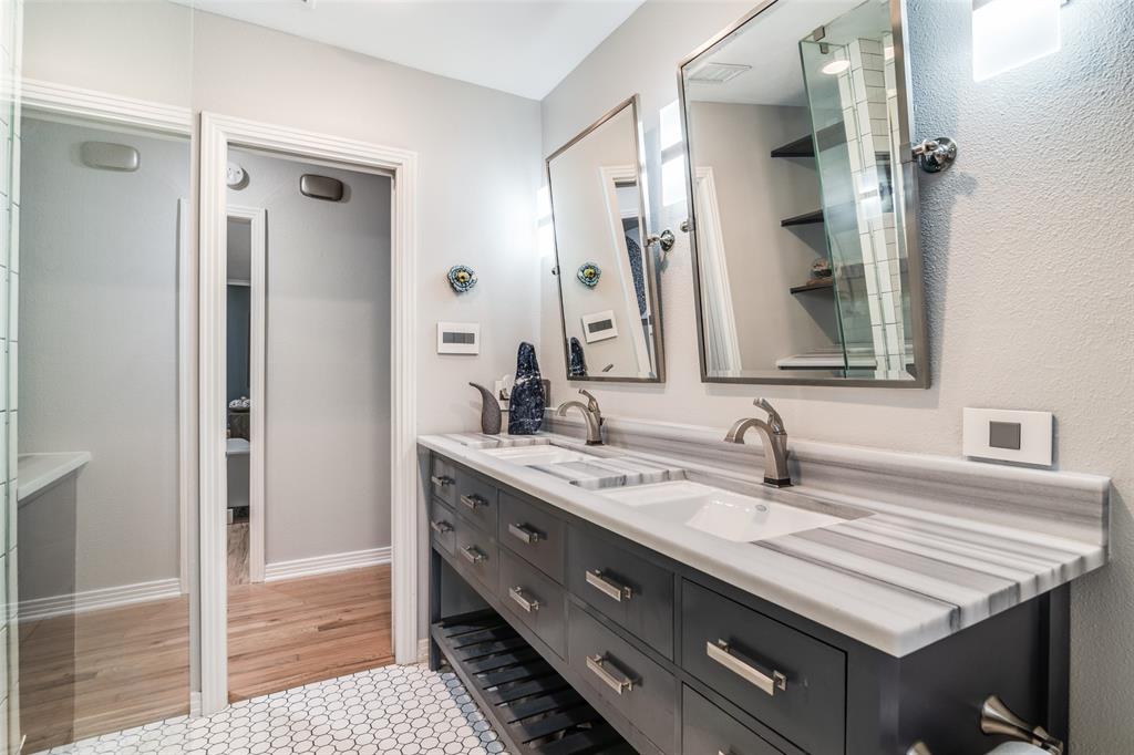 3714 Valley Ridge Road Dallas, TX 75220 - Photo 15 of 26 a bathroom with a sink and a mirror