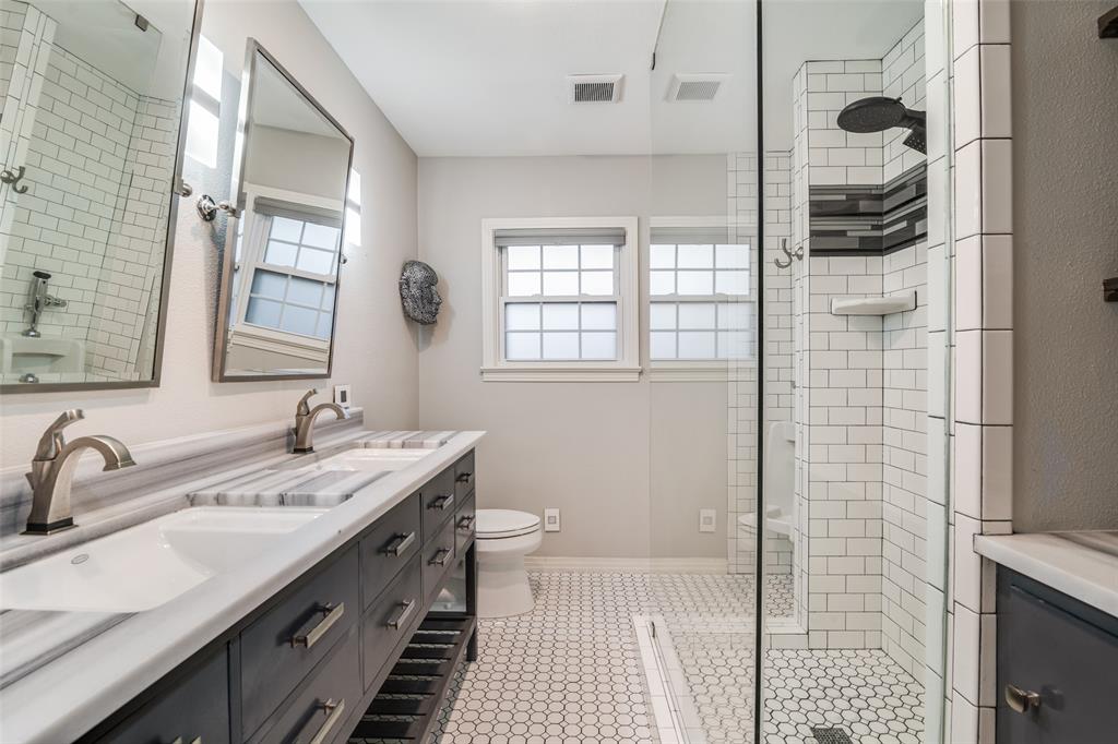 3714 Valley Ridge Road Dallas, TX 75220 - Photo 16 of 26 a bathroom with a double vanity sink and a shower
