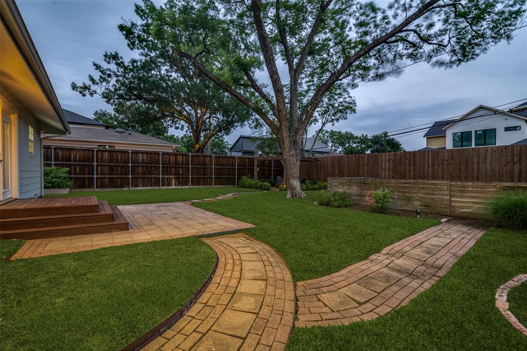 3714 Valley Ridge Road Dallas, TX 75220 - Photo 23 of 26 a view of a backyard with couches plants and large trees