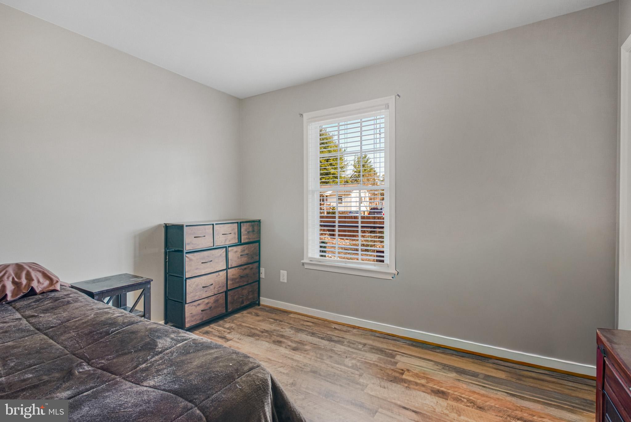 12254 Birkdale Road Ruther Glen, VA 22546 - Photo 18 of 68 a bedroom with a bed and a window