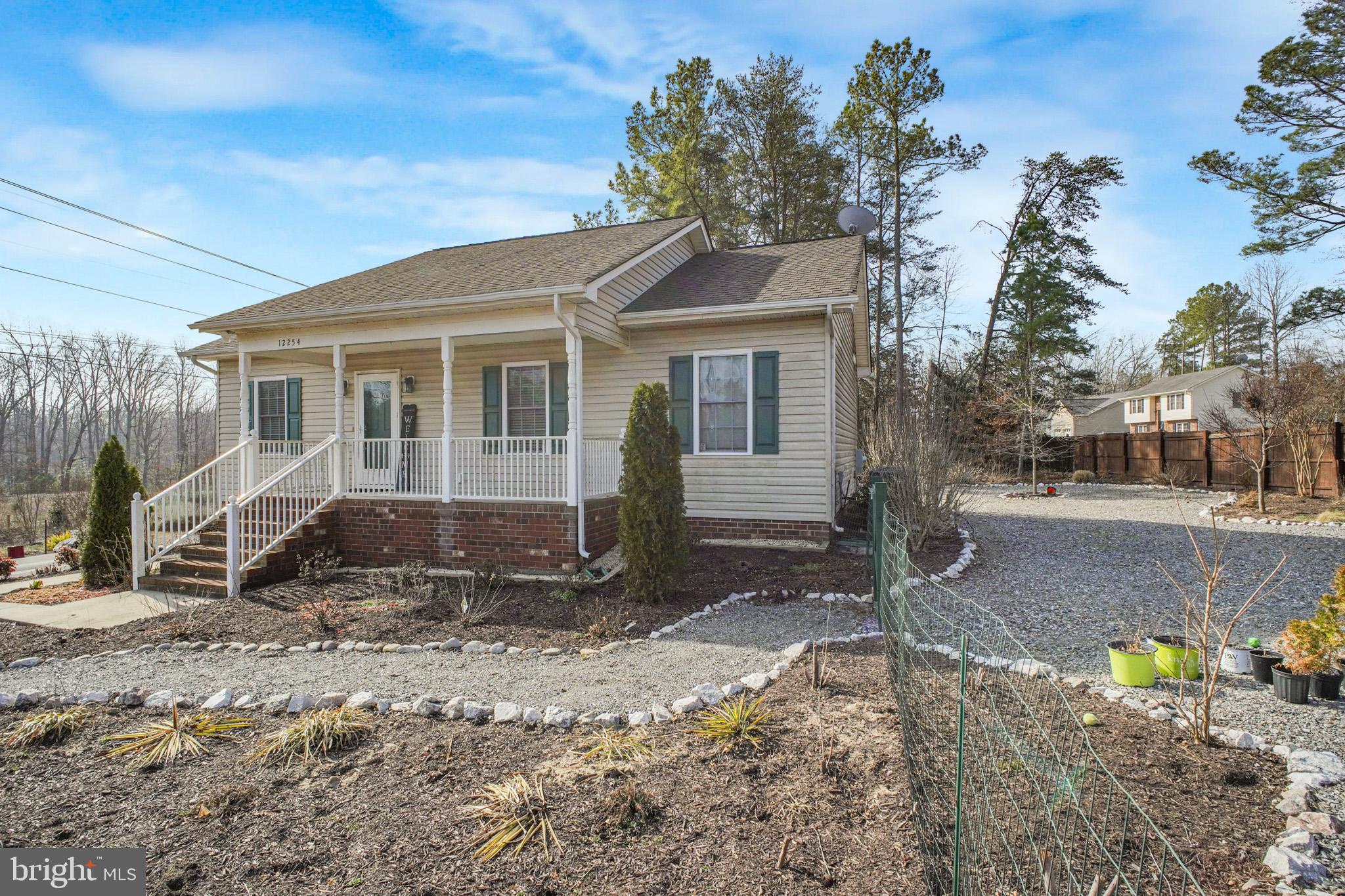 12254 Birkdale Road Ruther Glen, VA 22546 - Photo 22 of 68 a front view of a house with a yard