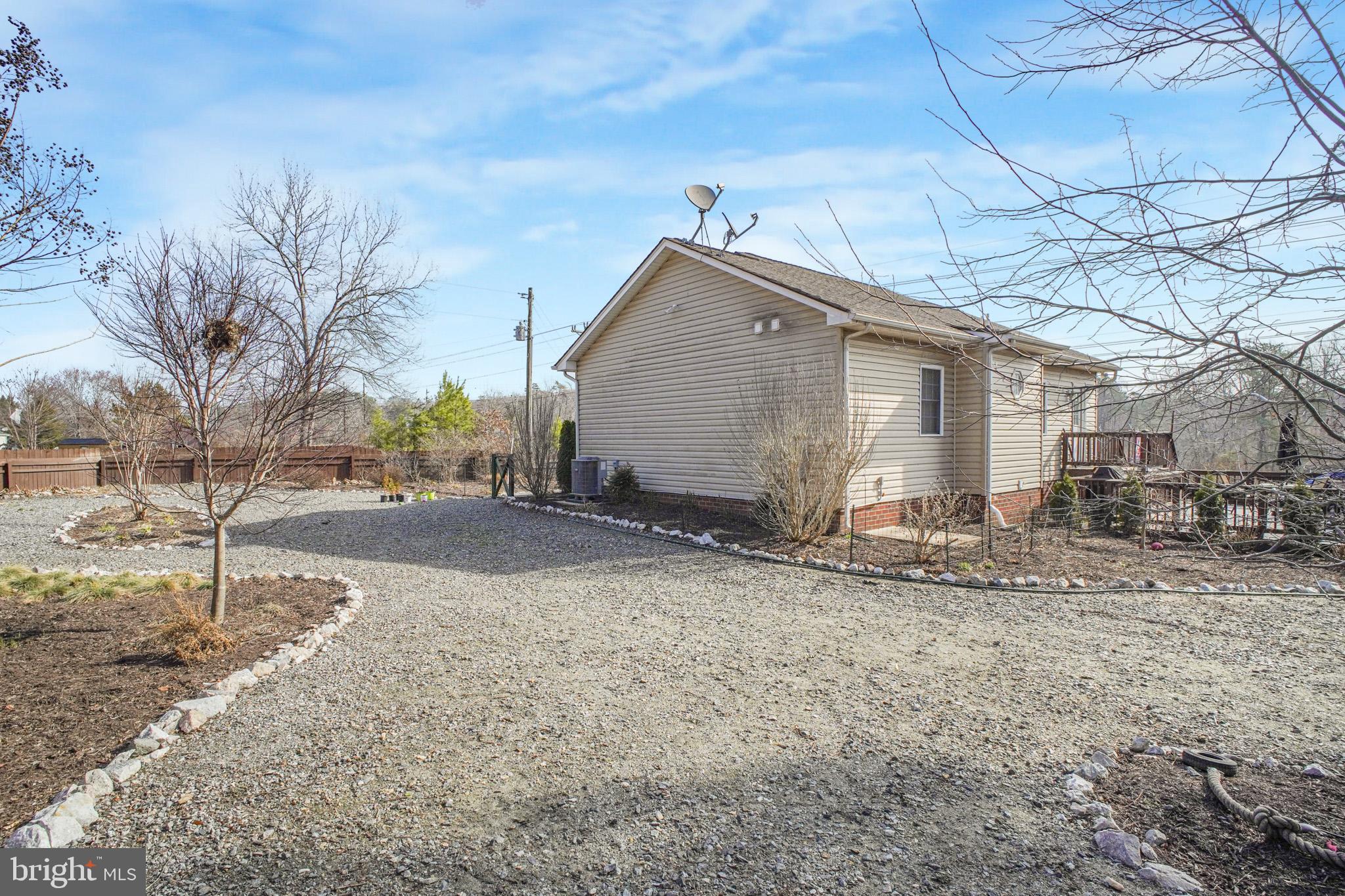 12254 Birkdale Road Ruther Glen, VA 22546 - Photo 29 of 68 a view of a house with a yard