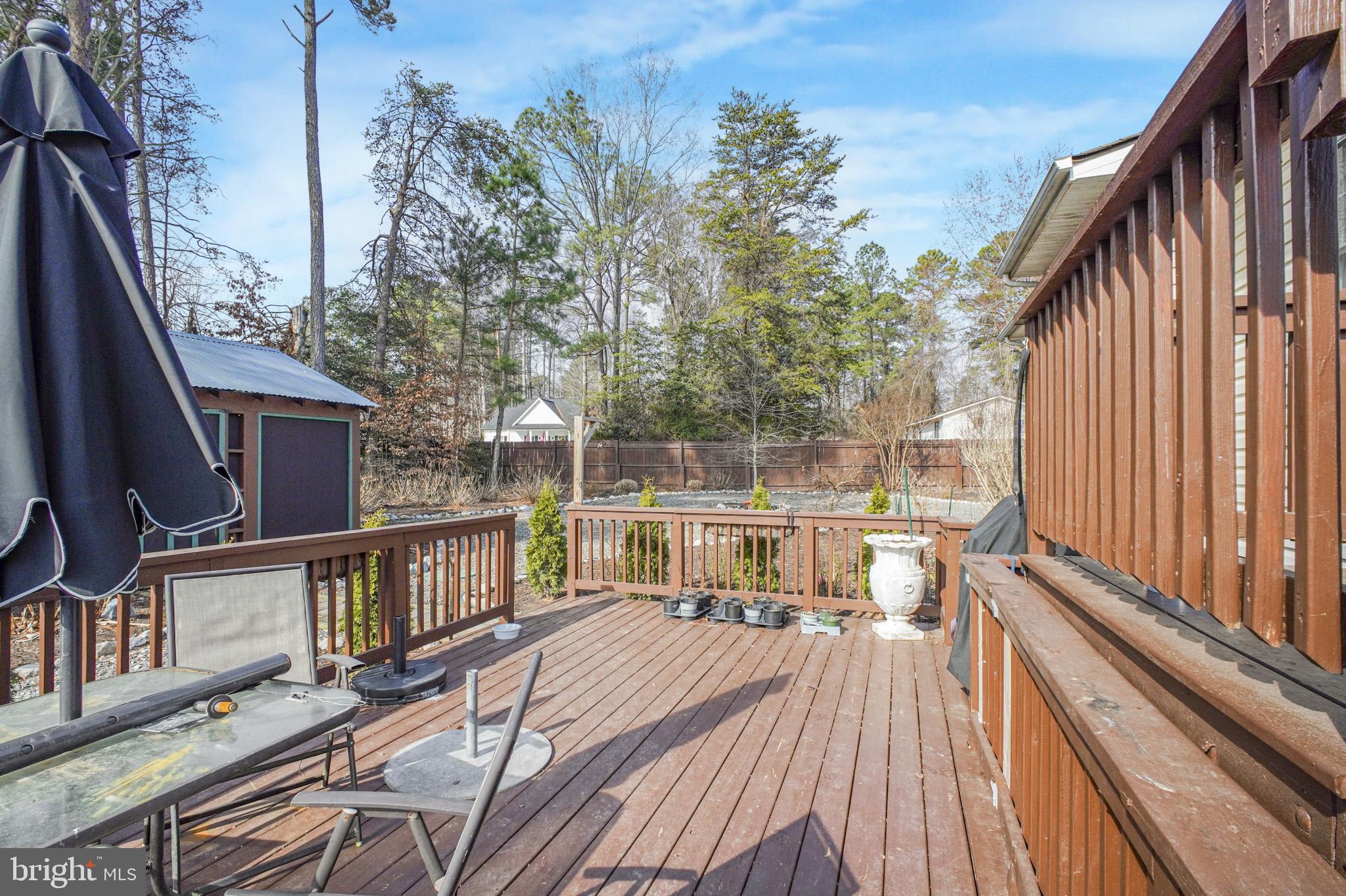 12254 Birkdale Road Ruther Glen, VA 22546 - Photo 39 of 68 a view of balcony with wooden floor and outdoor seating