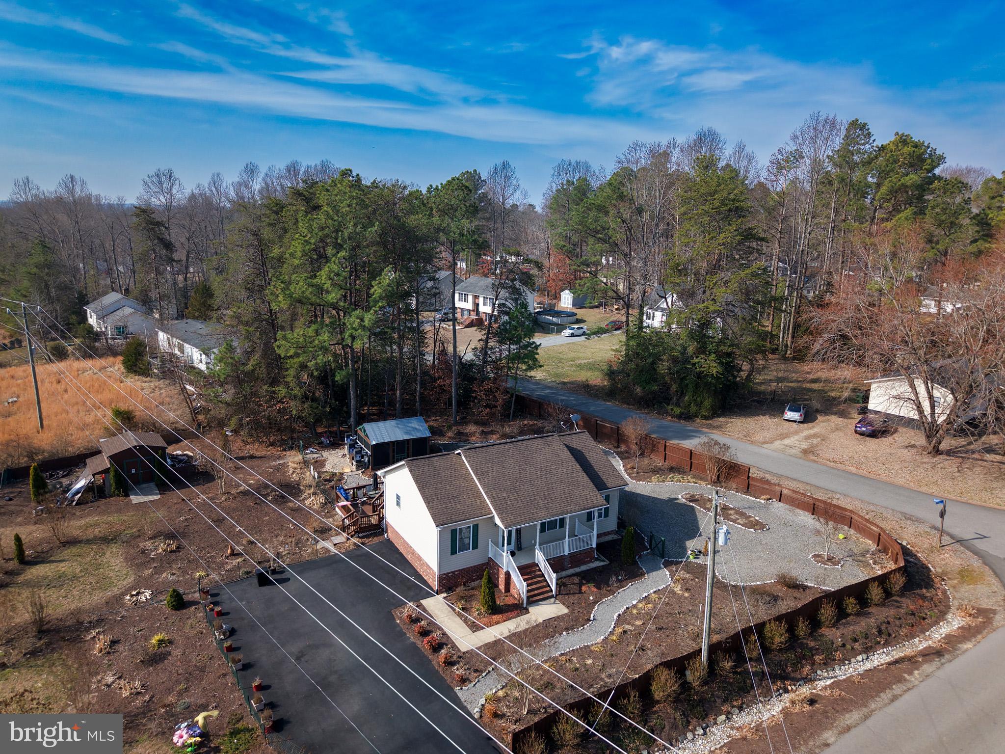 12254 Birkdale Road Ruther Glen, VA 22546 - Photo 50 of 68 an aerial view of a house with outdoor space