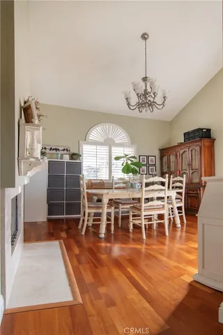 a view of a bedroom with wooden floor