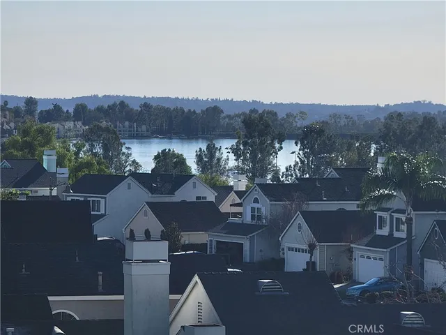 an aerial view of residential house and car parked