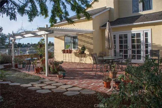 a view of a tables and chairs in patio