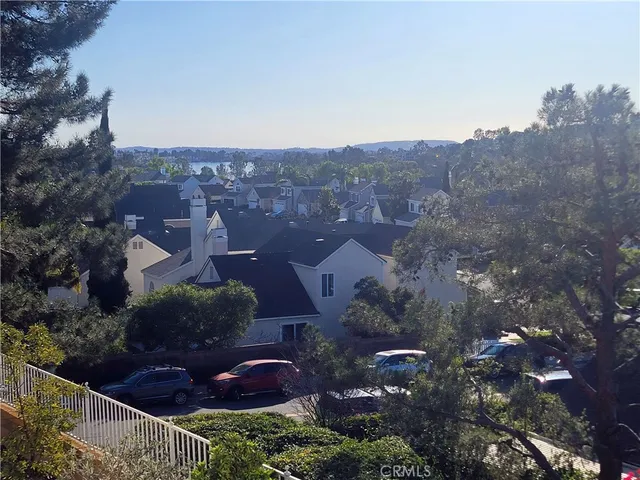 a living room with furniture large window and a fireplace