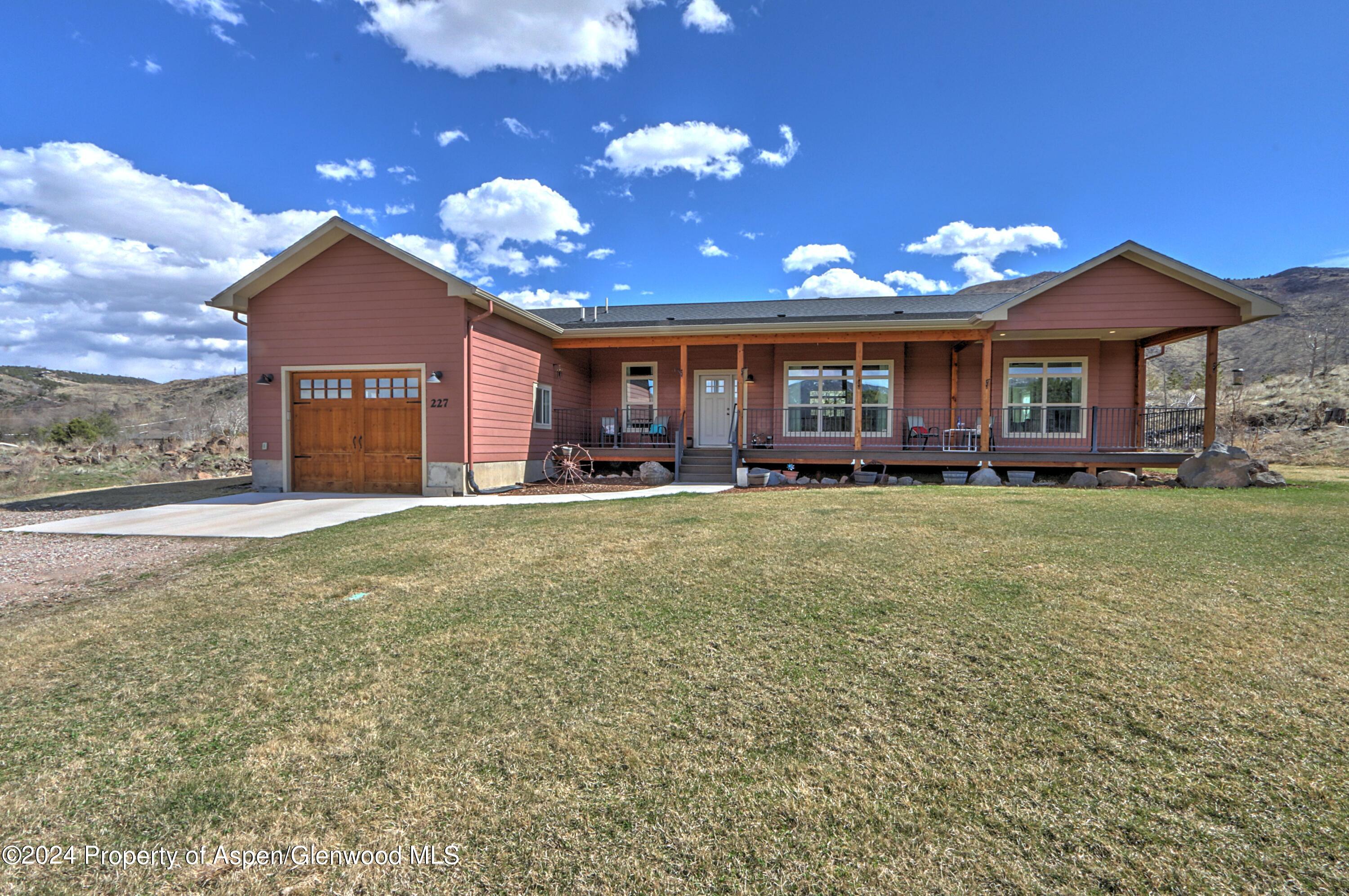 a view of a house with a yard