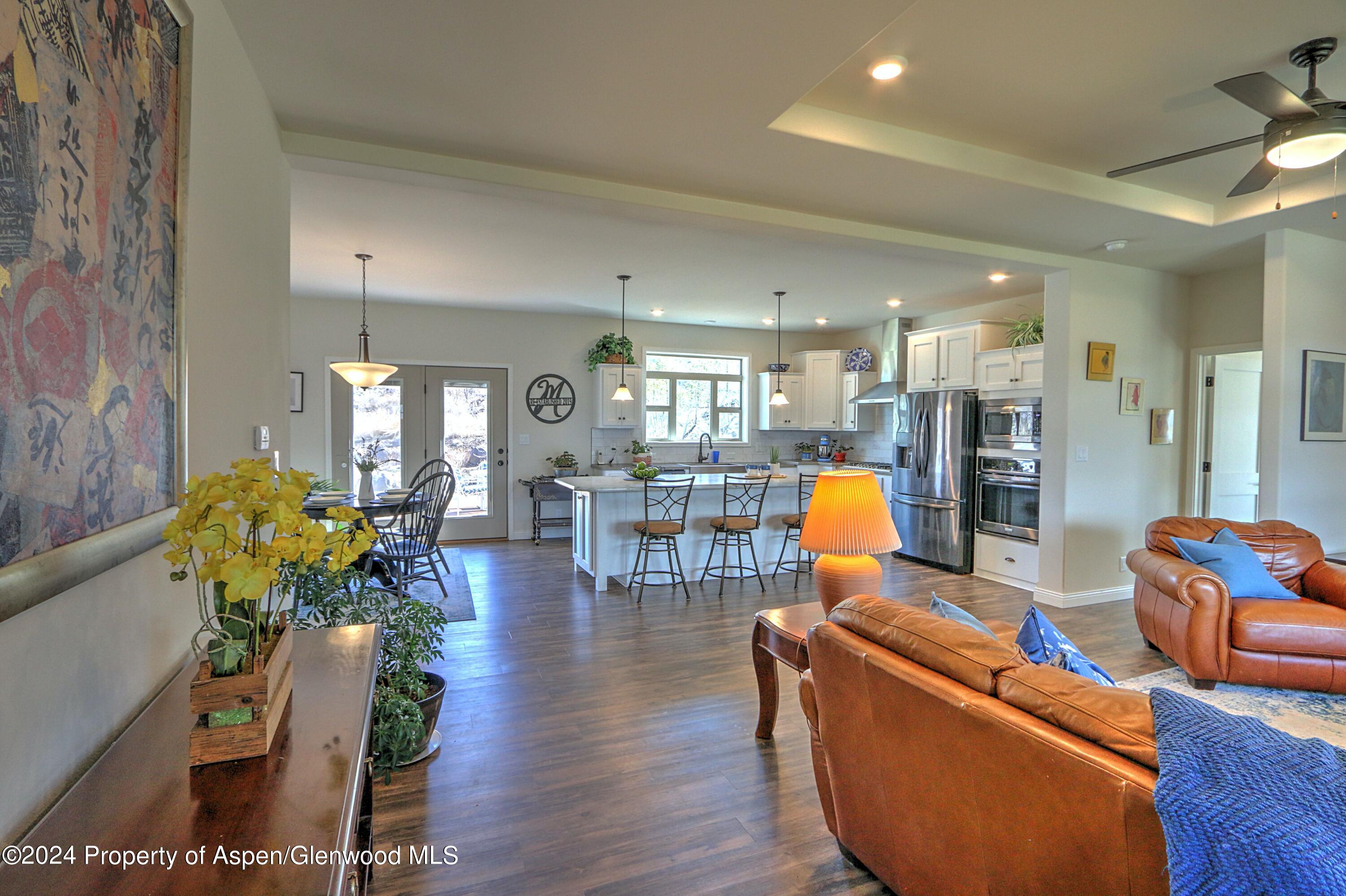 227 Lava Drive El Jebel, CO 81621 - Photo 2 of 38 a living room with furniture and wooden floors