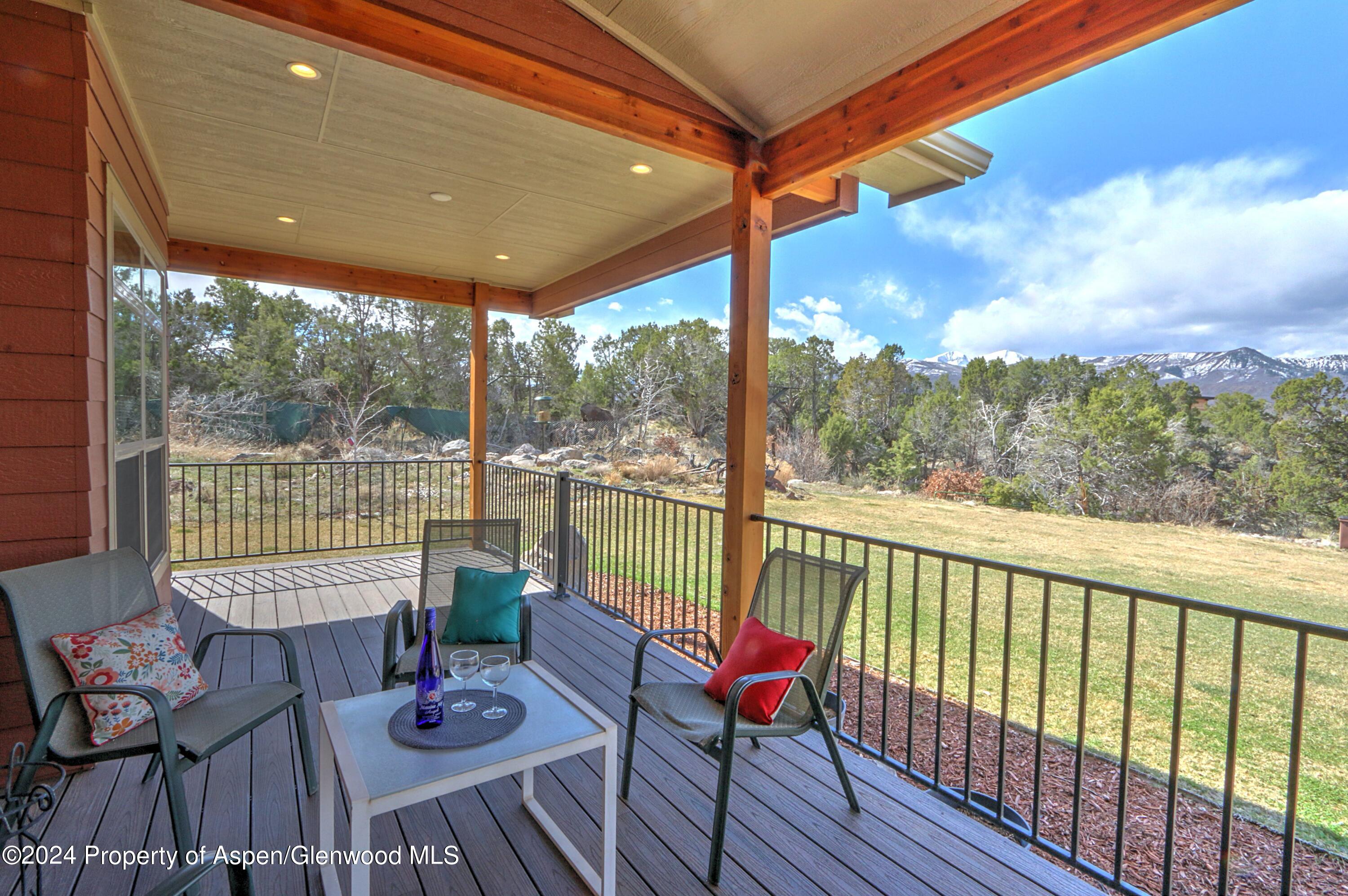 227 Lava Drive El Jebel, CO 81621 - Photo 25 of 38 a view of a chair and table in the balcony