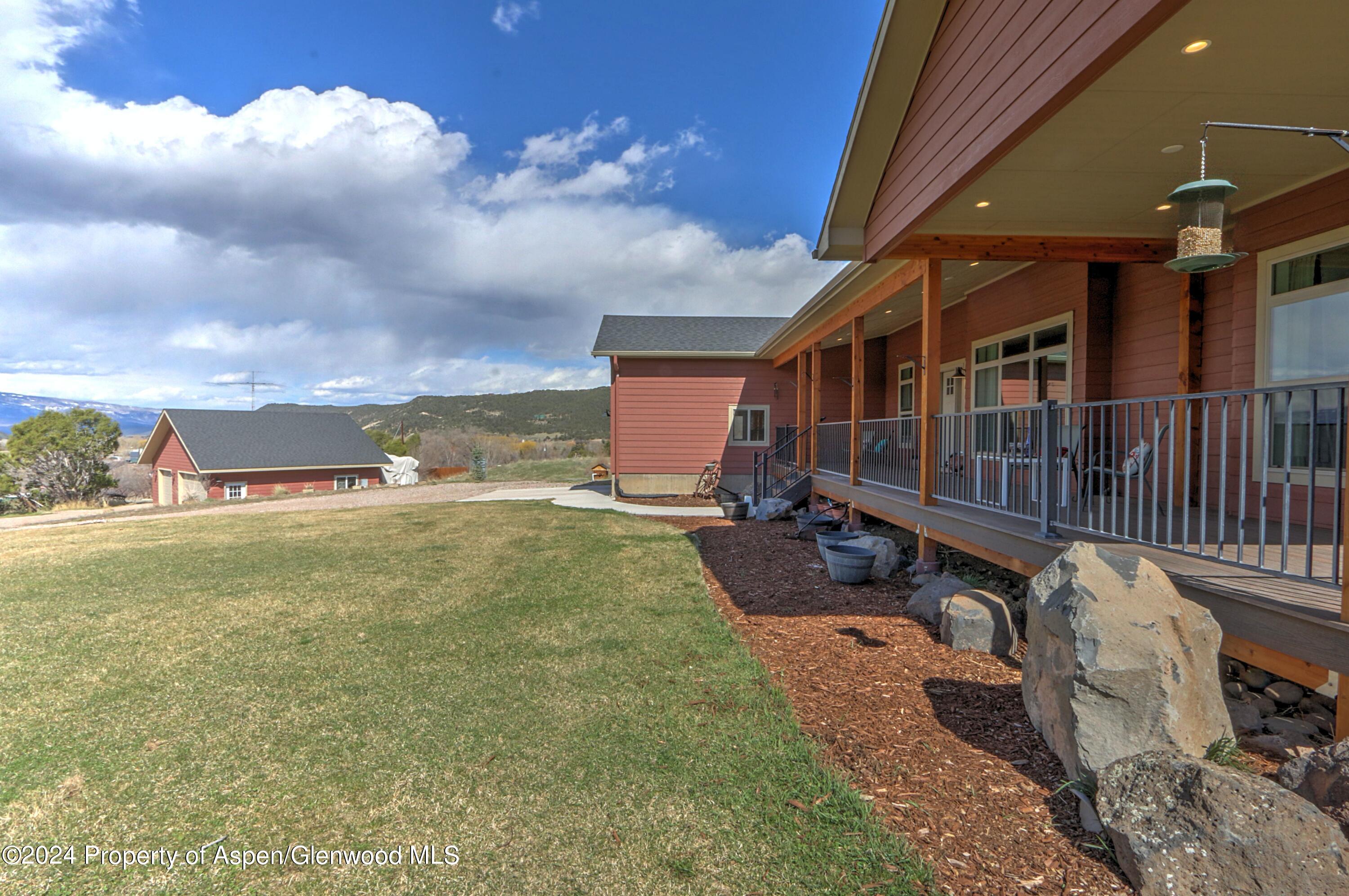 227 Lava Drive El Jebel, CO 81621 - Photo 26 of 38 a view of a porch with furniture and a yard