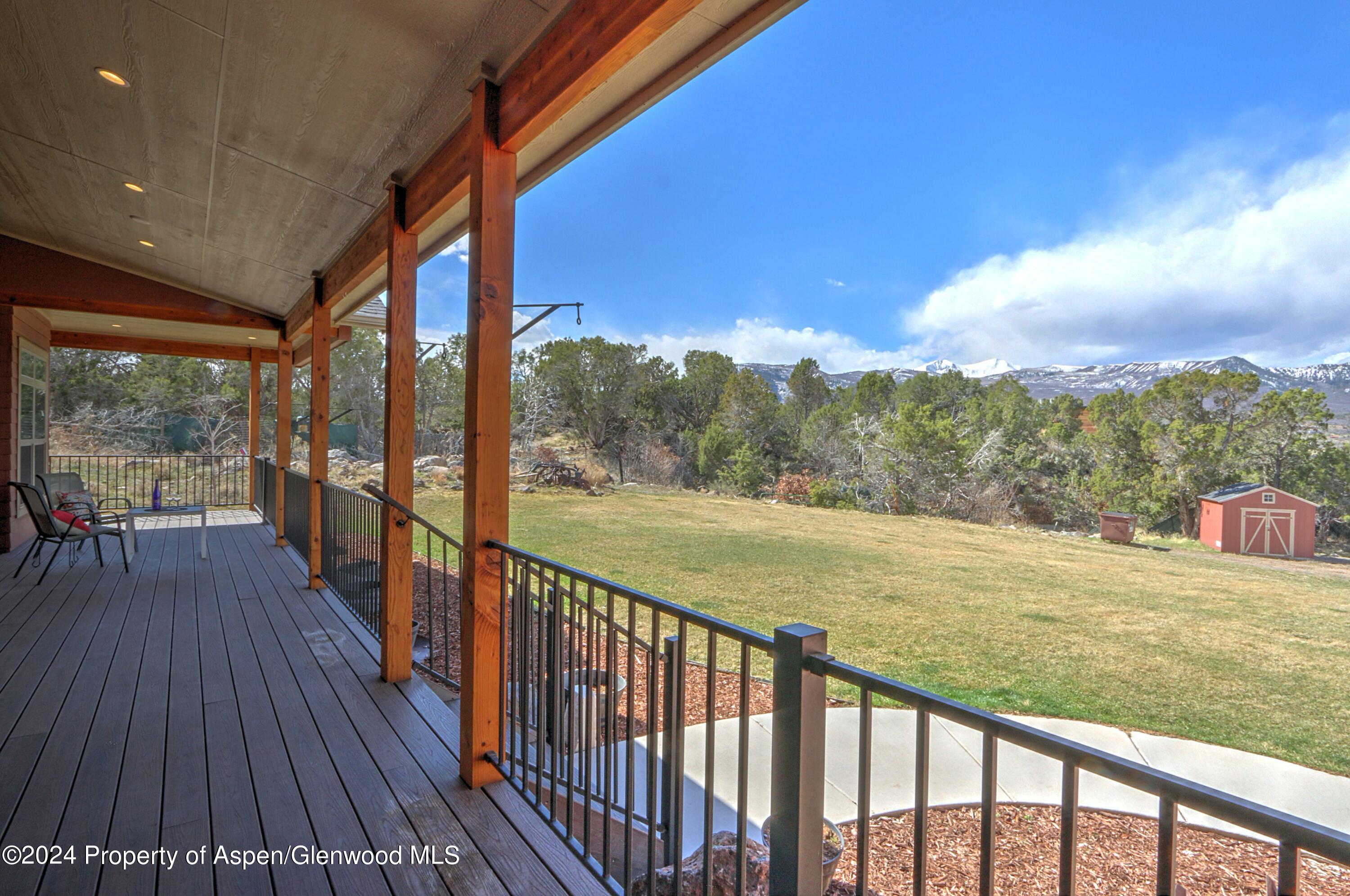 227 Lava Drive El Jebel, CO 81621 - Photo 27 of 38 a view of a balcony with mountain view and wooden floor