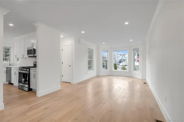 a view of a livingroom with wooden floor