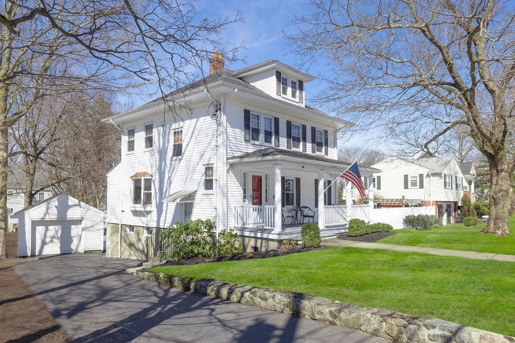 60 High Street Needham, MA 02494 - Photo 3 of 32 a front view of a house with a garden and trees