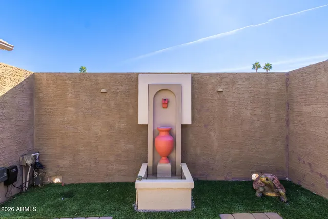 a front view of a house with plants