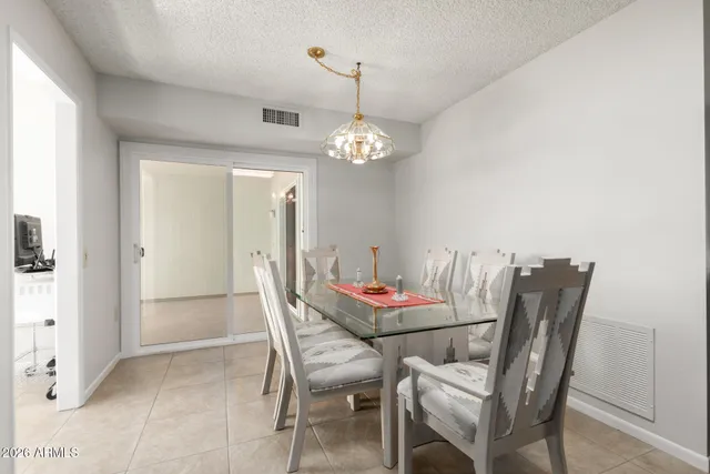 a dining room with furniture and window