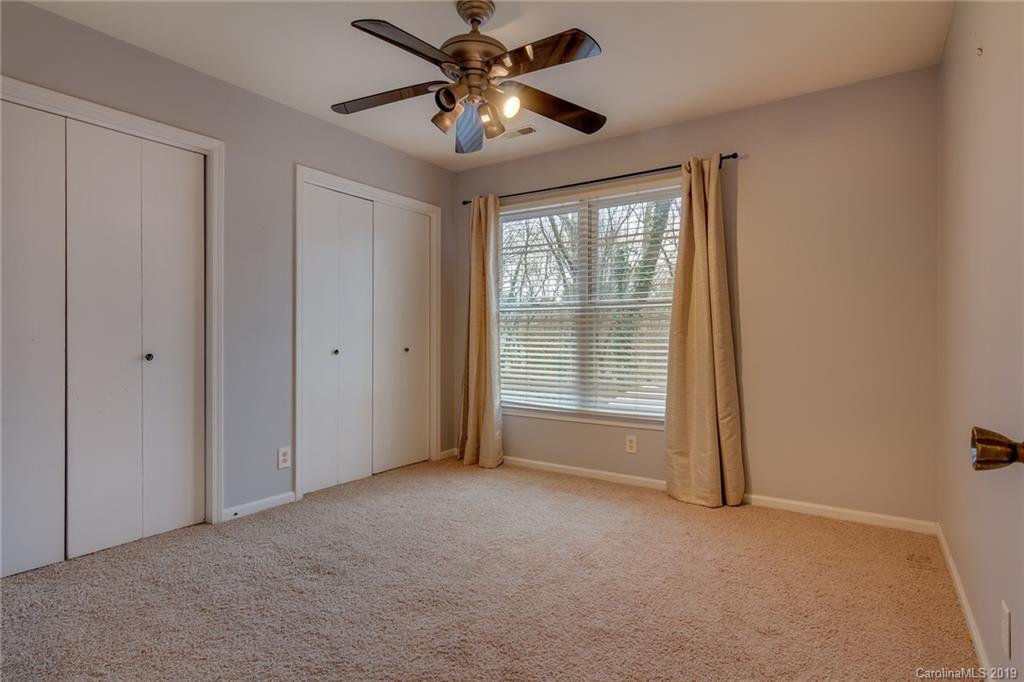 2103 Bon Villa Way, Unit 103 Tega Cay, SC 29708 - Photo 14 of 19 a view of an empty room with a window