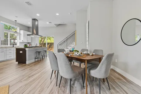 a kitchen with stainless steel appliances granite countertop a sink and a stove