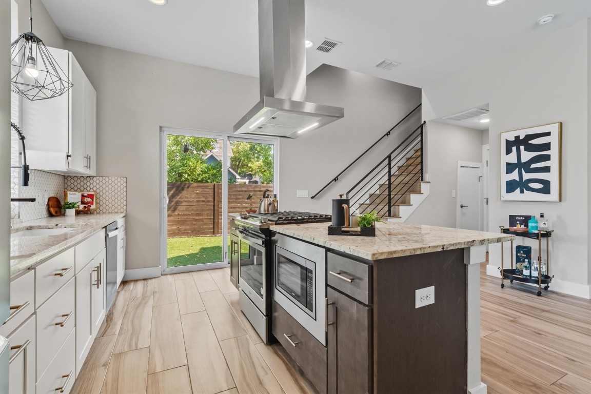 5609 Tura Lane, Unit A Austin, TX 78721 - Photo 15 of 38 This island serves as the perfect gathering spot for entertaining, facilitating connections with guests while cooking and serving.