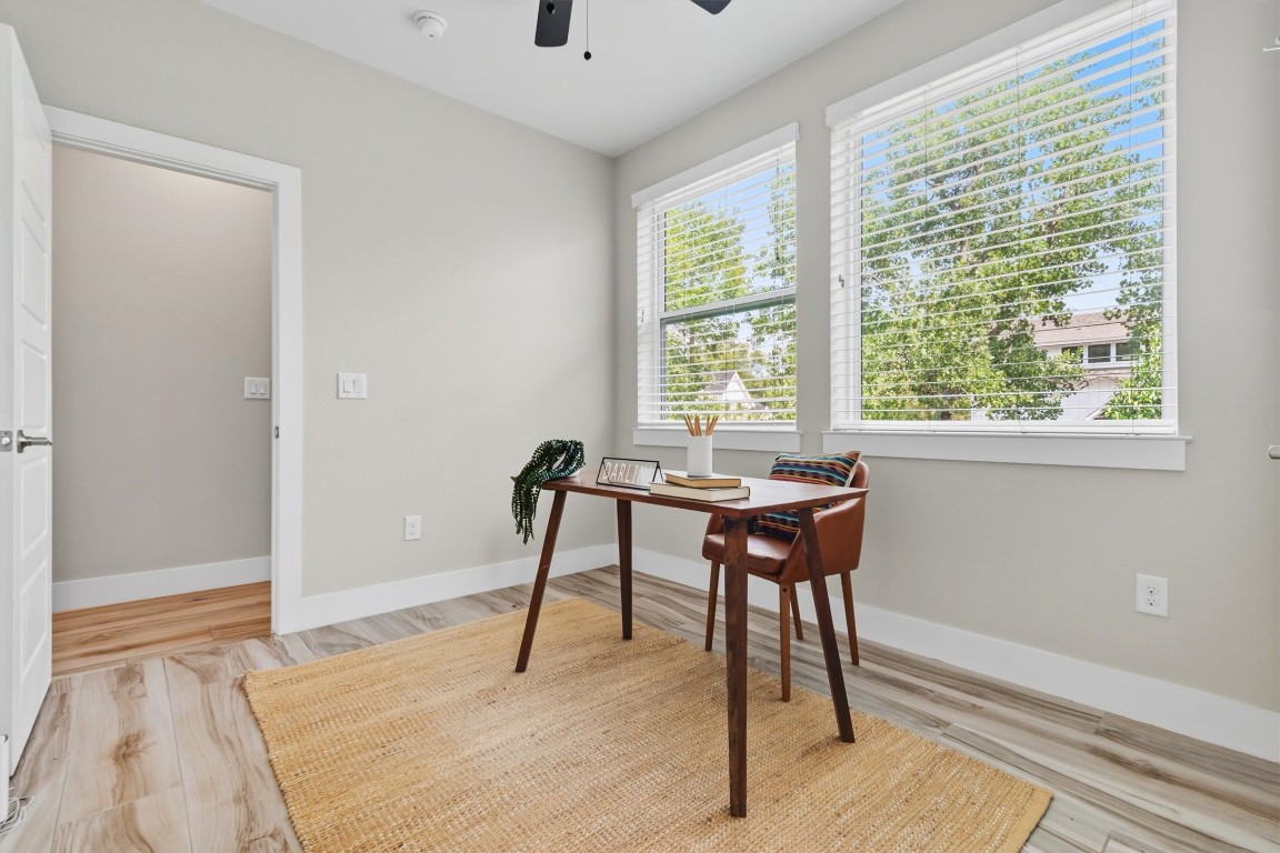 5609 Tura Lane, Unit A Austin, TX 78721 - Photo 24 of 38 a bedroom with a bed and a window