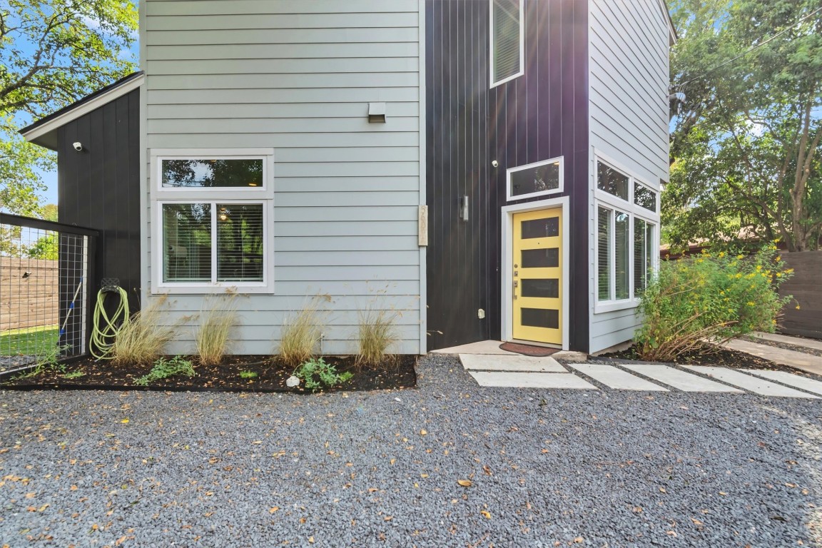 5609 Tura Lane, Unit A Austin, TX 78721 - Photo 7 of 38 a front view of a house with garden