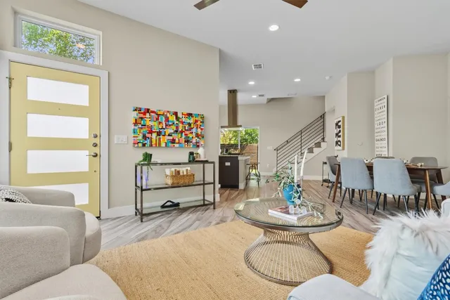 a kitchen with stainless steel appliances granite countertop a sink and a stove