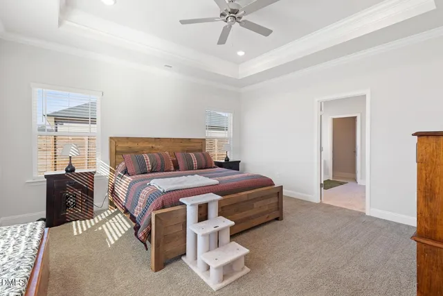 a spacious bedroom with a bed and a window