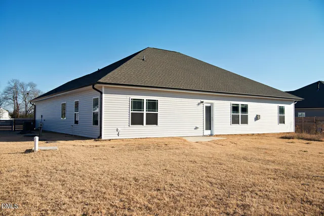 an aerial view of a house with a lake view