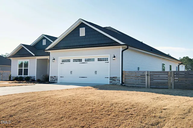 a aerial view of a house with a yard