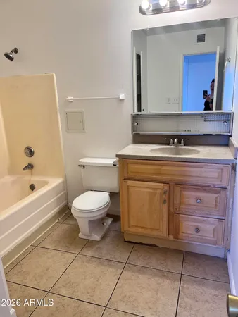 a bathroom with a toilet a sink and bathtub