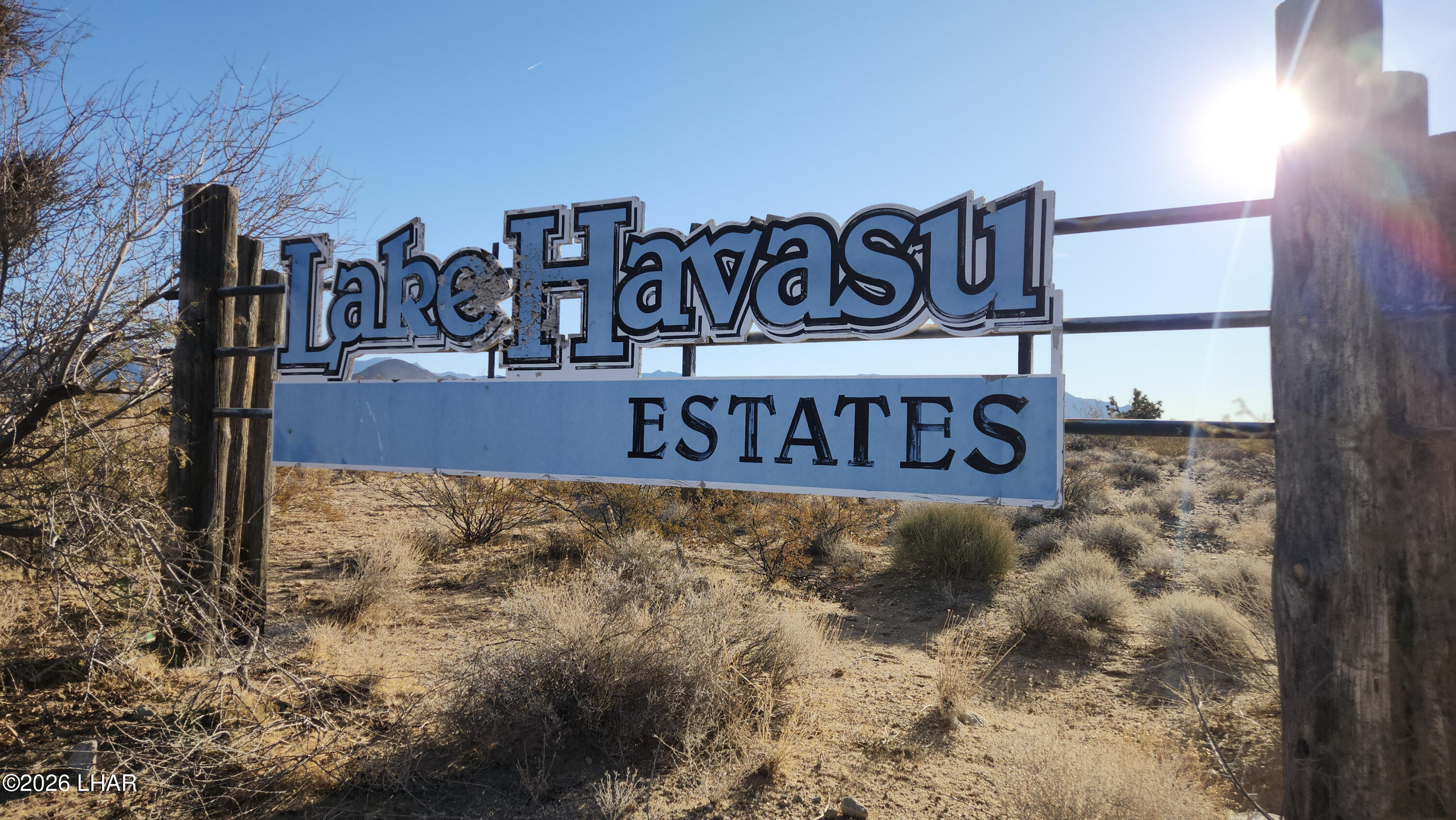 171-172 South Nash Road Yucca, AZ 86438 - Photo 7 of 11 a view of outdoor space with signage and flags
