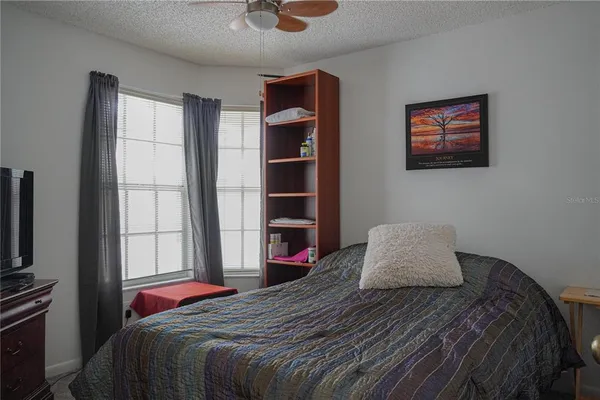 a bedroom with a bed and a closet