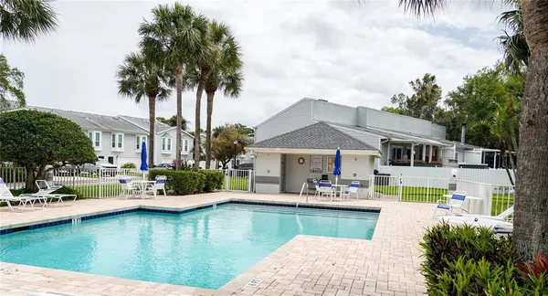 a front view of house with yard and lake view
