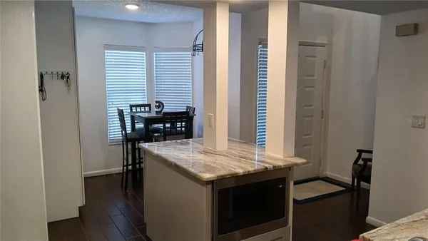 a kitchen with a table and chairs