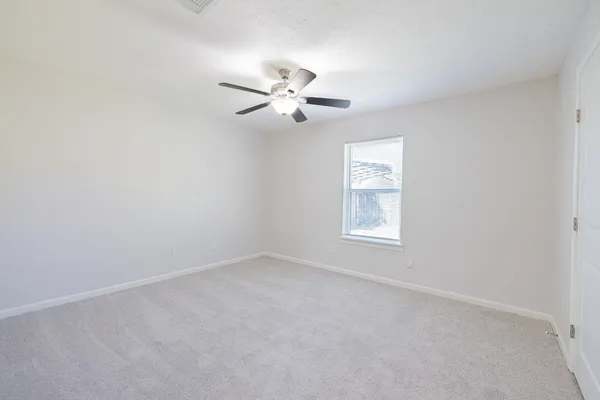 a white toilet sitting next to a shower