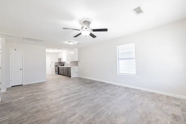 a kitchen with a sink and refrigerator