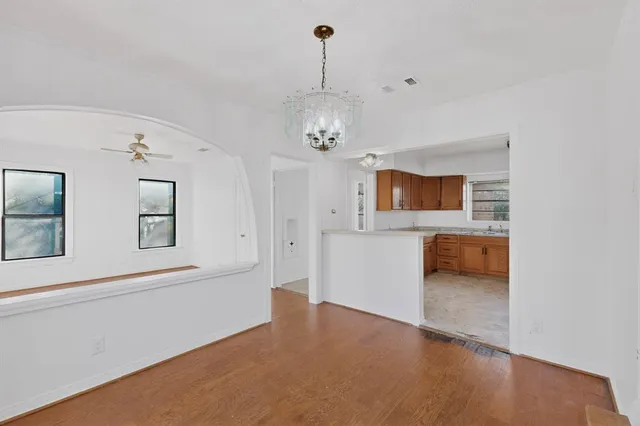 a view of a hallway with a kitchen