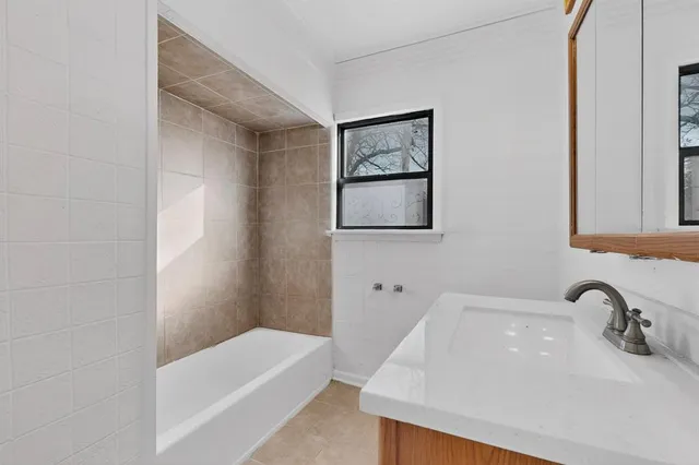 a bathroom with a sink and a bathtub