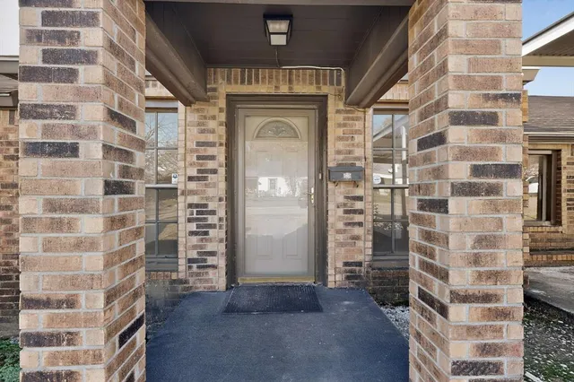 view of a brick building next to a building