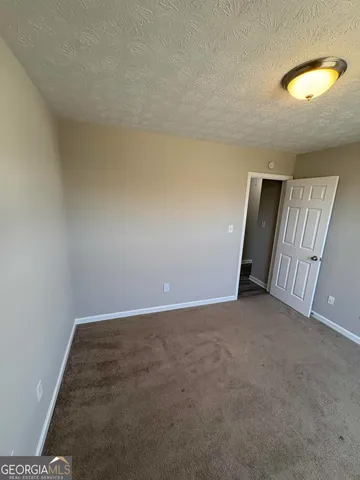 an empty room with a mirror