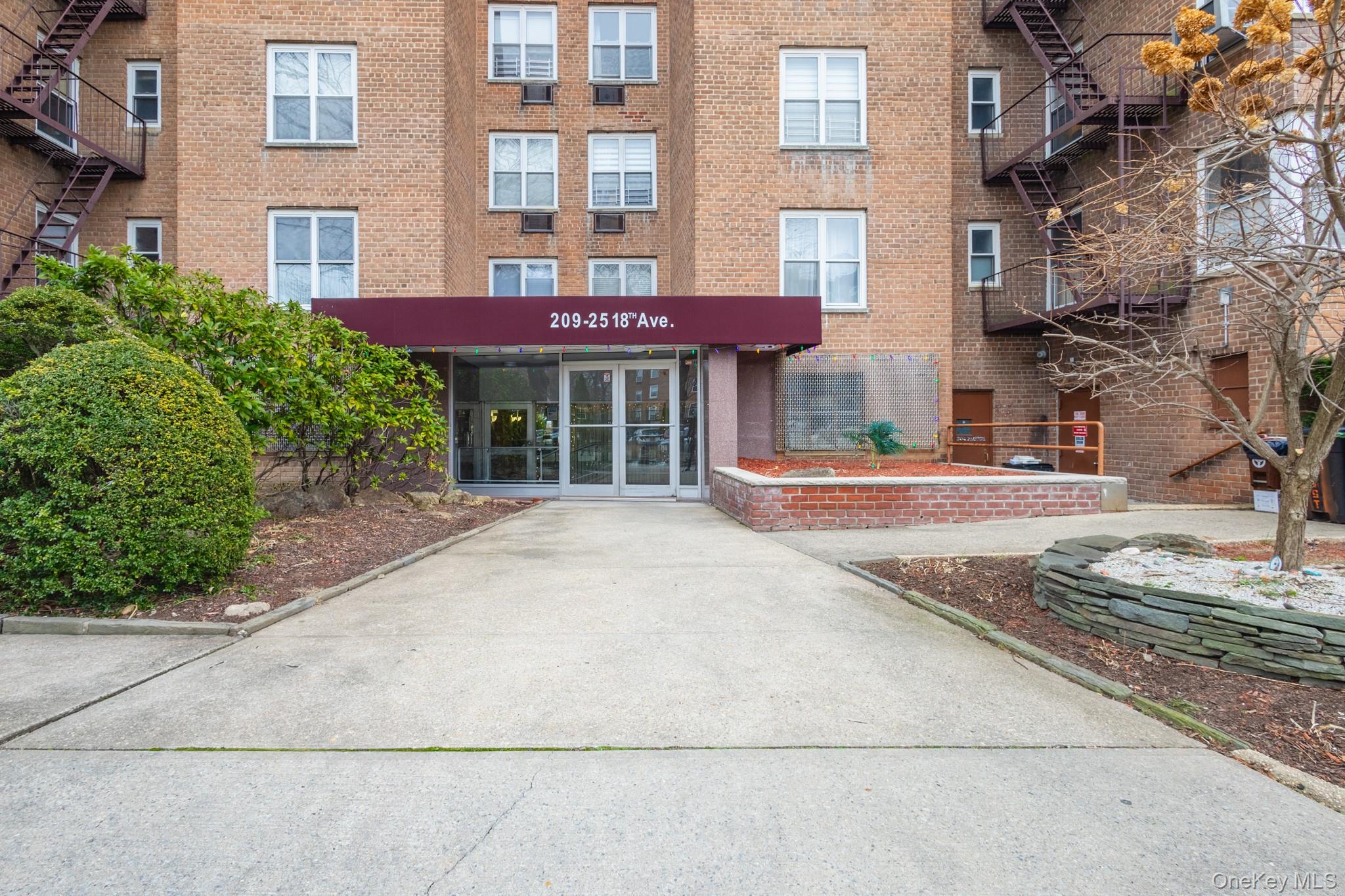 209-25 18th Avenue, Unit 3F Queens, NY 11360 - Photo 1 of 28 a front view of a building