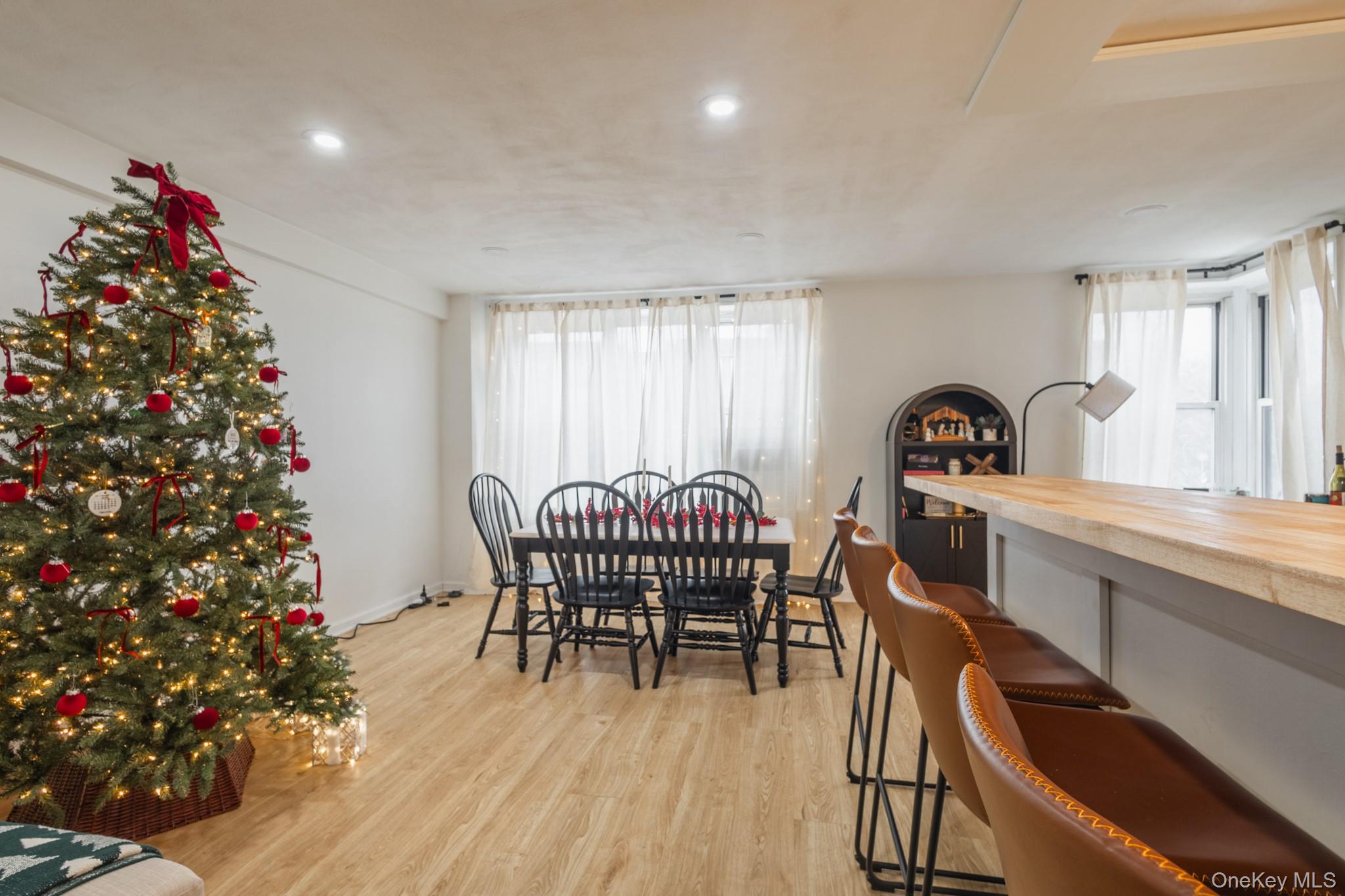 209-25 18th Avenue, Unit 3F Queens, NY 11360 - Photo 11 of 28 a dining room with furniture and window