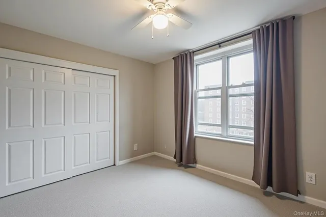 a bedroom with a bed and a closet