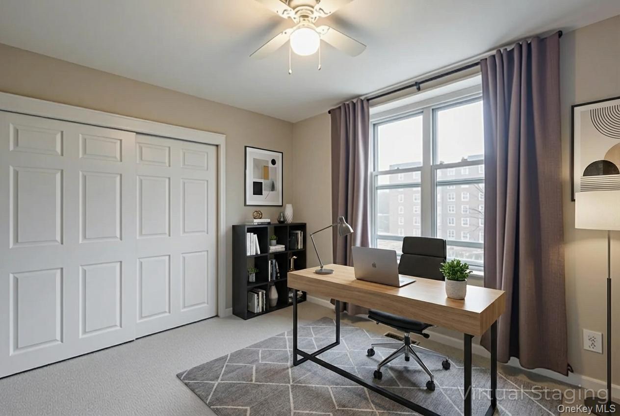 209-25 18th Avenue, Unit 3F Queens, NY 11360 - Photo 17 of 28 a view of a workspace with furniture and a window