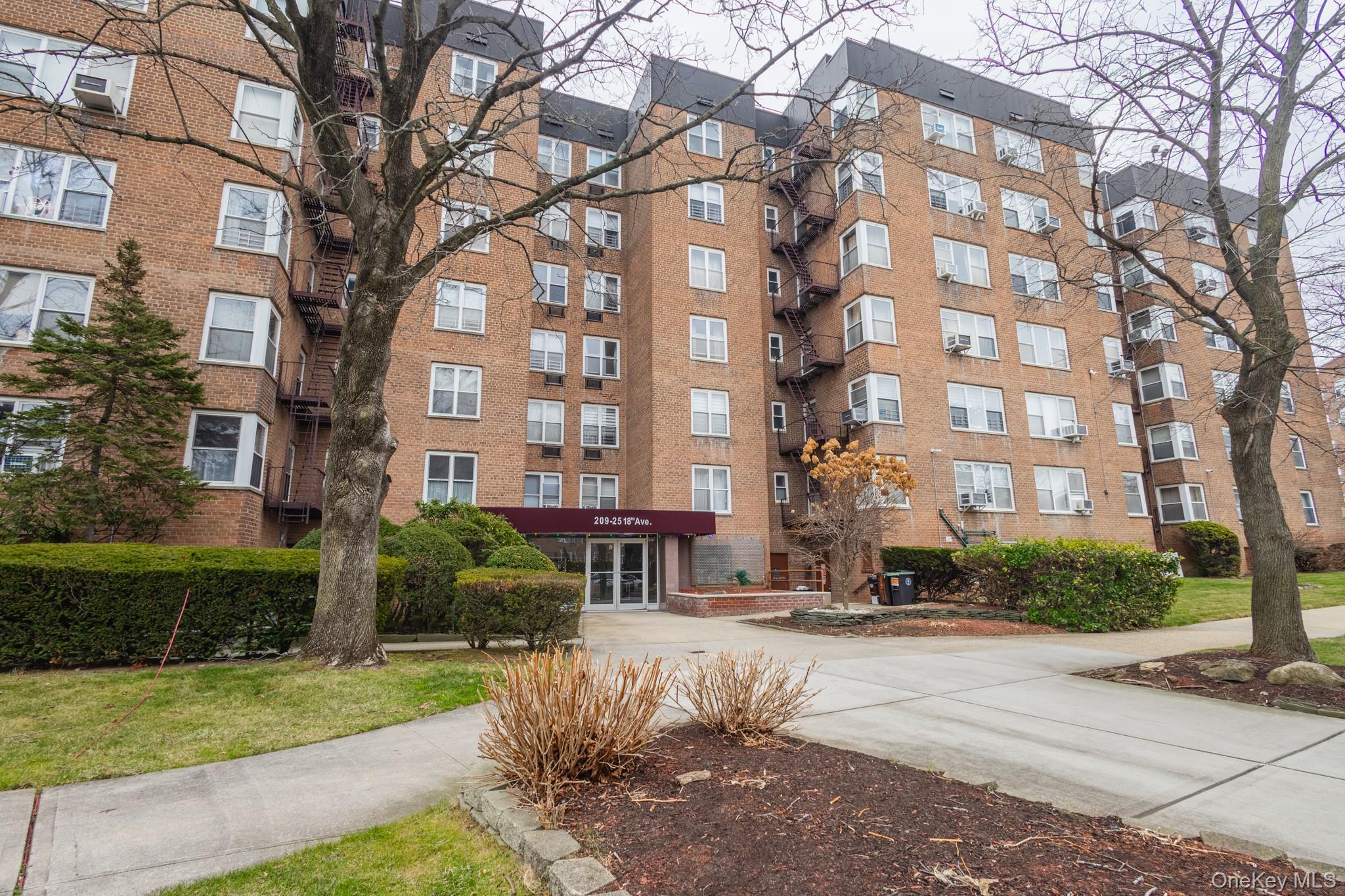 209-25 18th Avenue, Unit 3F Queens, NY 11360 - Photo 24 of 28 a front view of a building